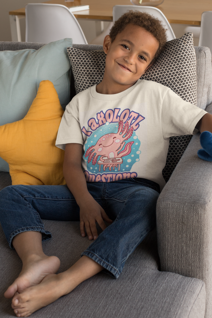 t shirt mockup featuring a smiling kid sitting on a couch 31639